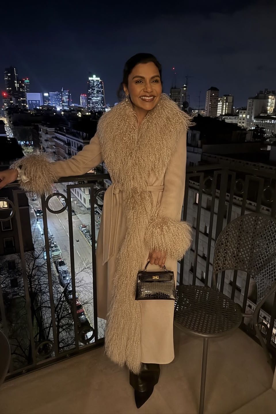 Mindy Kaling wearing Inez Suede Shearling Maxi Coat